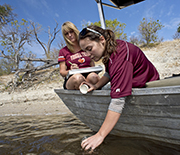 Scientists collect samples from the Chobe River for water quality assessments.